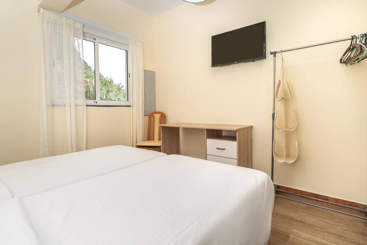 Uma cama ou camas num quarto em TarmarPlace