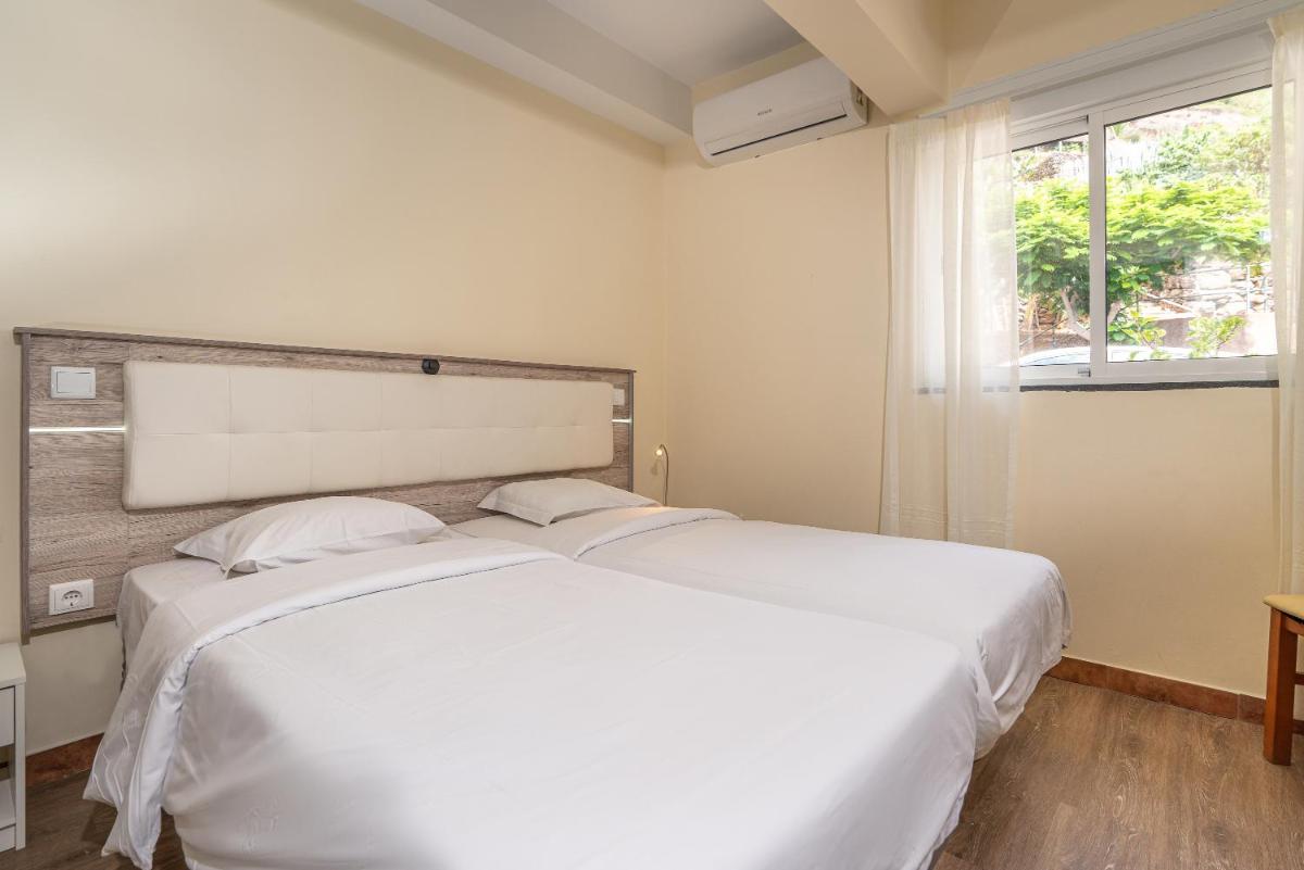 Uma cama ou camas num quarto em TarmarPlace