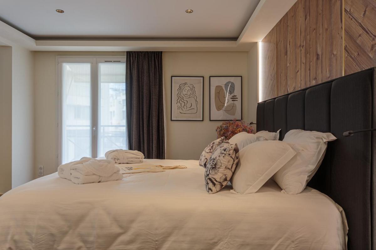 Un ou plusieurs lits dans un hébergement de l'établissement Grand Tonic Hotel & SPA NUXE