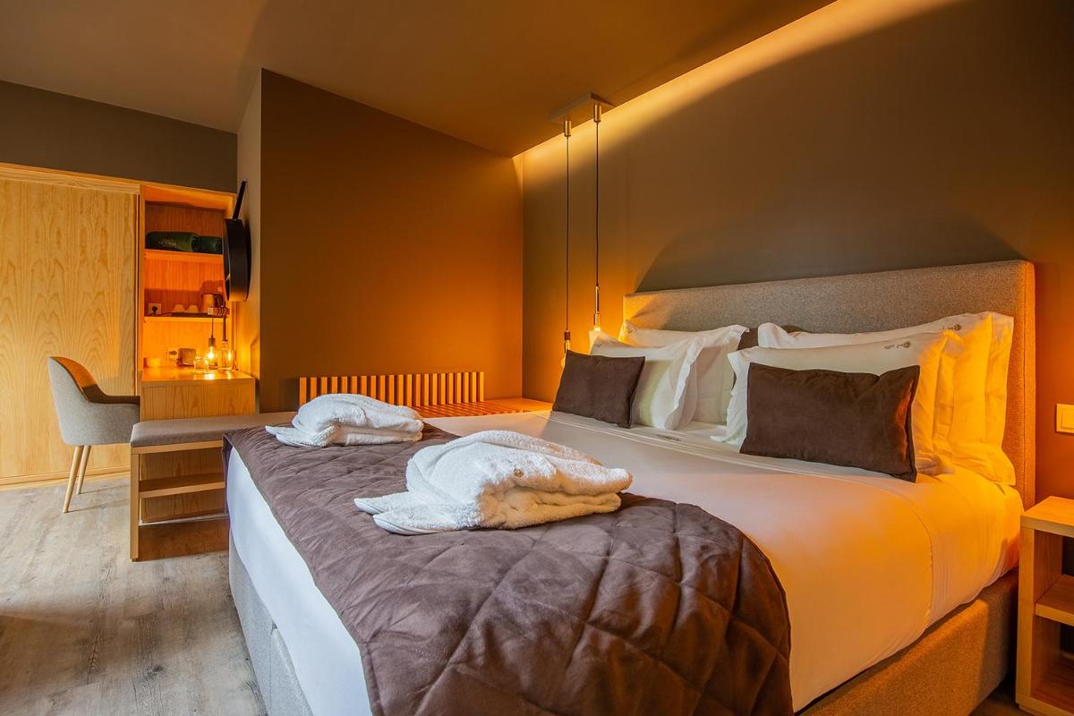Uma cama ou camas num quarto em Quinta do Pedregal Hotel & Spa