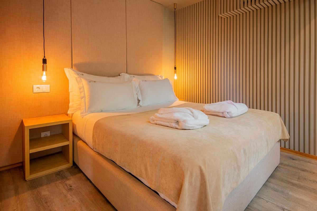 Uma cama ou camas num quarto em Quinta do Pedregal Hotel & Spa