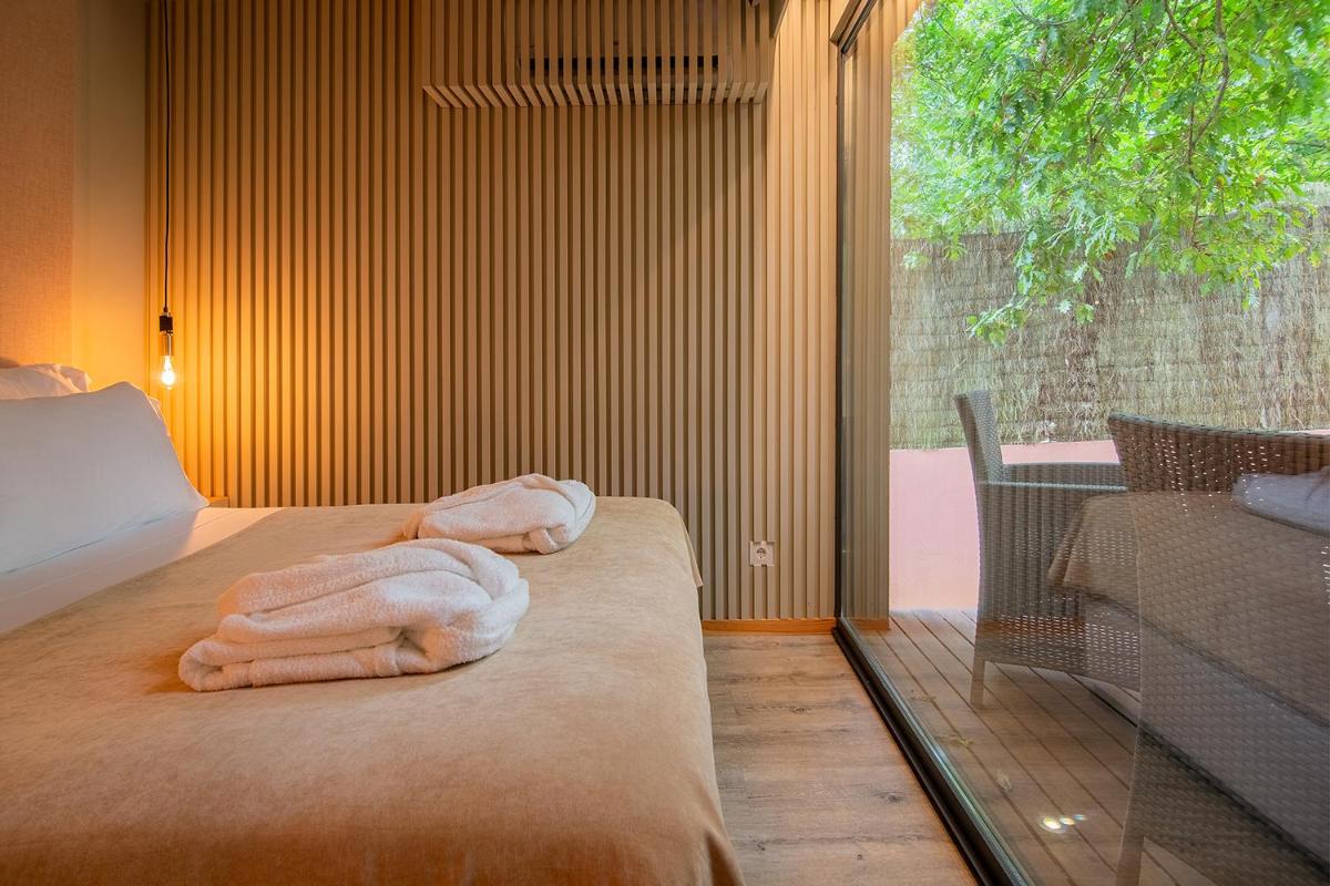 Uma cama ou camas num quarto em Quinta do Pedregal Hotel & Spa