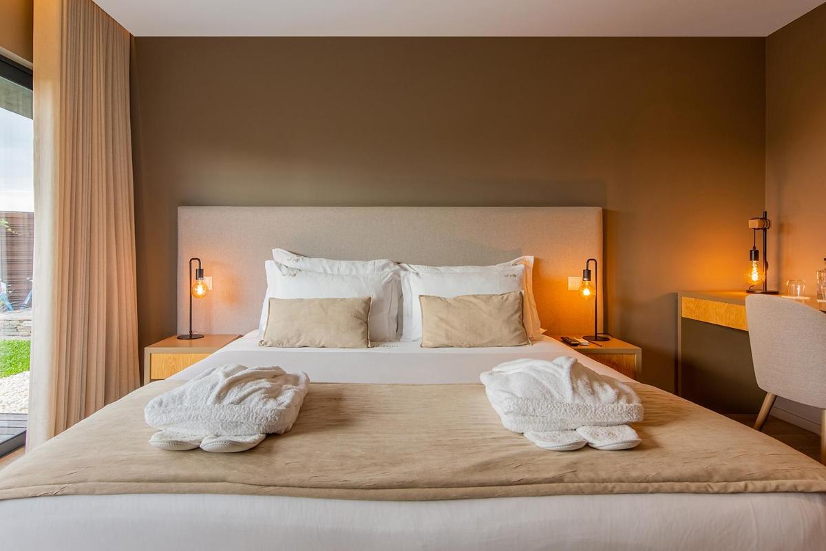 Uma cama ou camas num quarto em Quinta do Pedregal Hotel & Spa