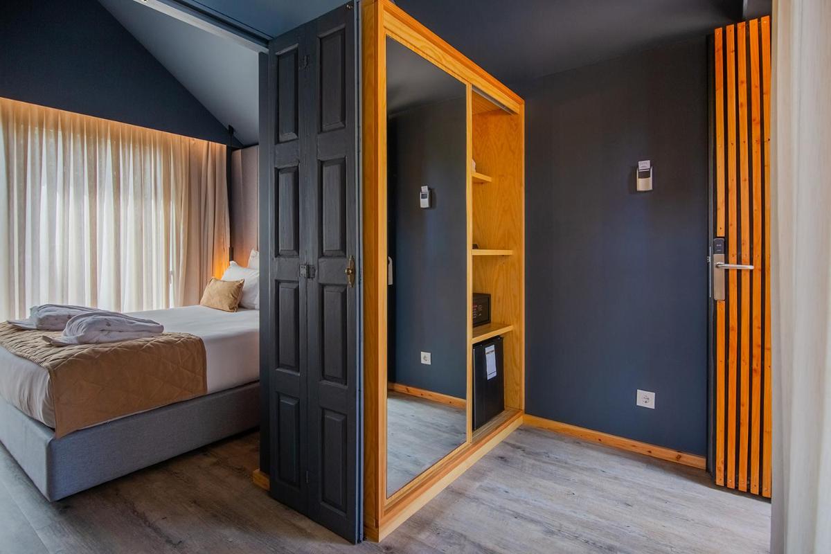 Uma cama ou camas num quarto em Quinta do Pedregal Hotel & Spa