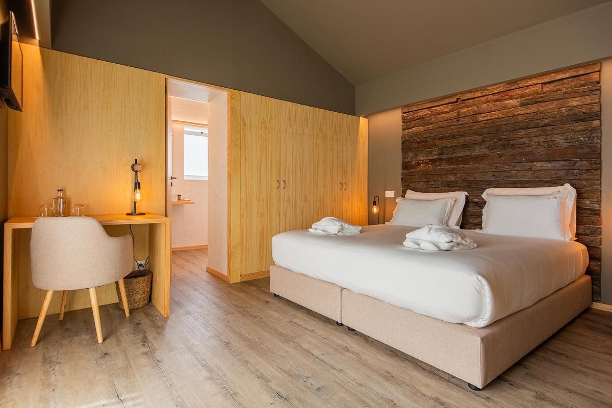Uma cama ou camas num quarto em Quinta do Pedregal Hotel & Spa