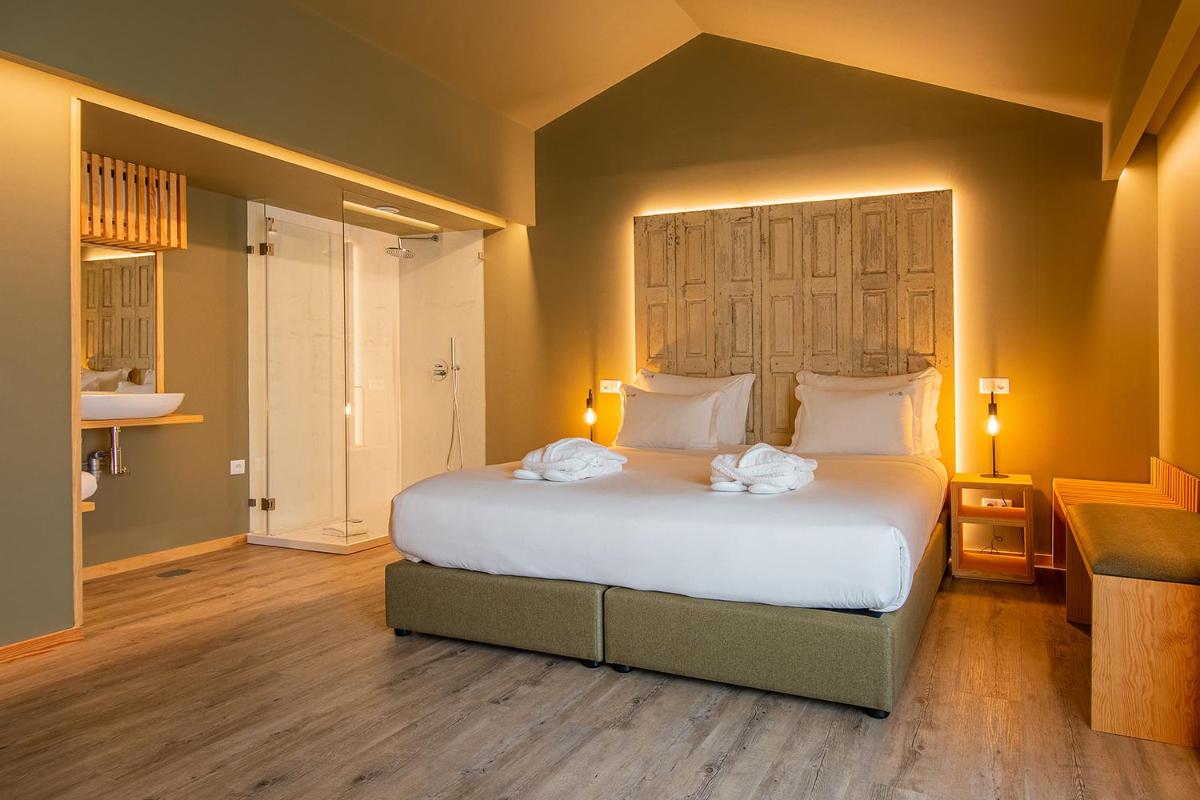 Uma cama ou camas num quarto em Quinta do Pedregal Hotel & Spa