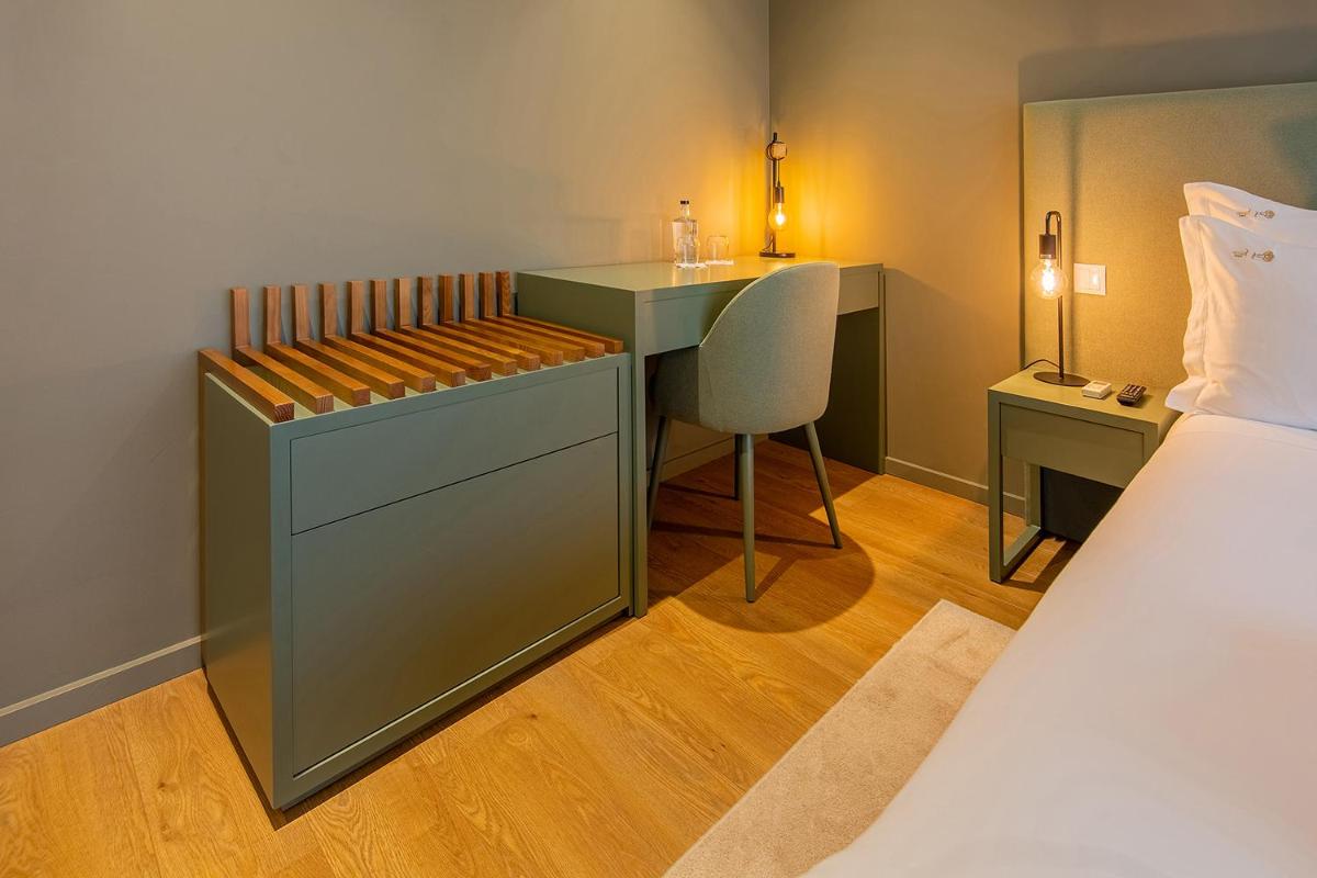 Uma cama ou camas num quarto em Quinta do Pedregal Hotel & Spa