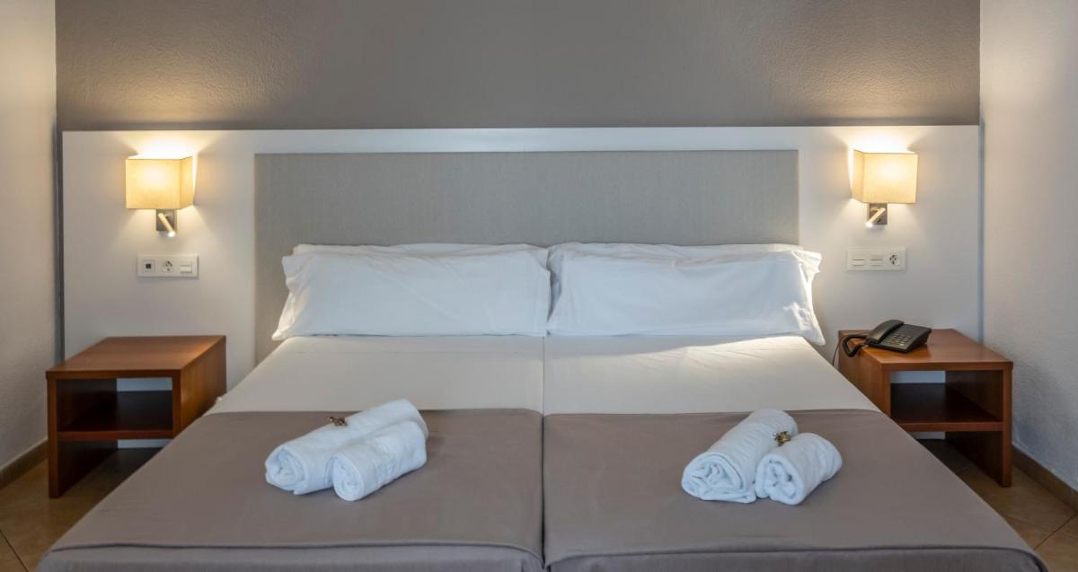 Cama o camas de una habitación en Rosamar & Spa 4*s