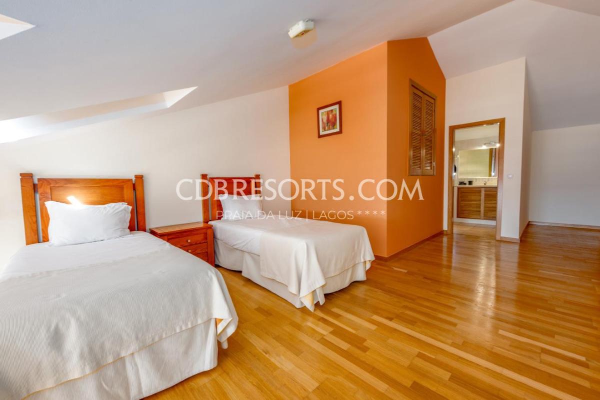 Uma cama ou camas num quarto em Estrela da Luz Resort