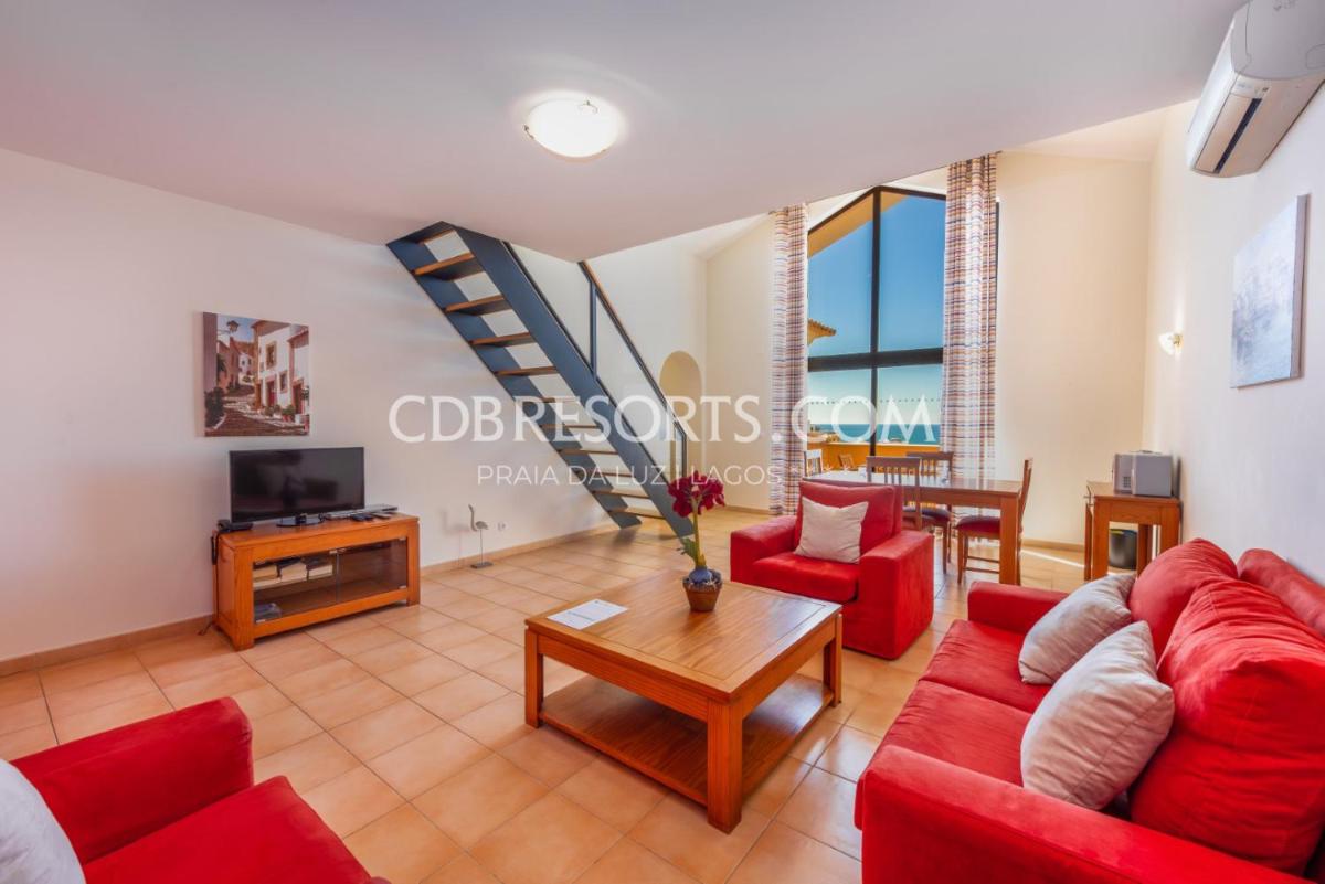 Uma área de estar em Estrela da Luz Resort