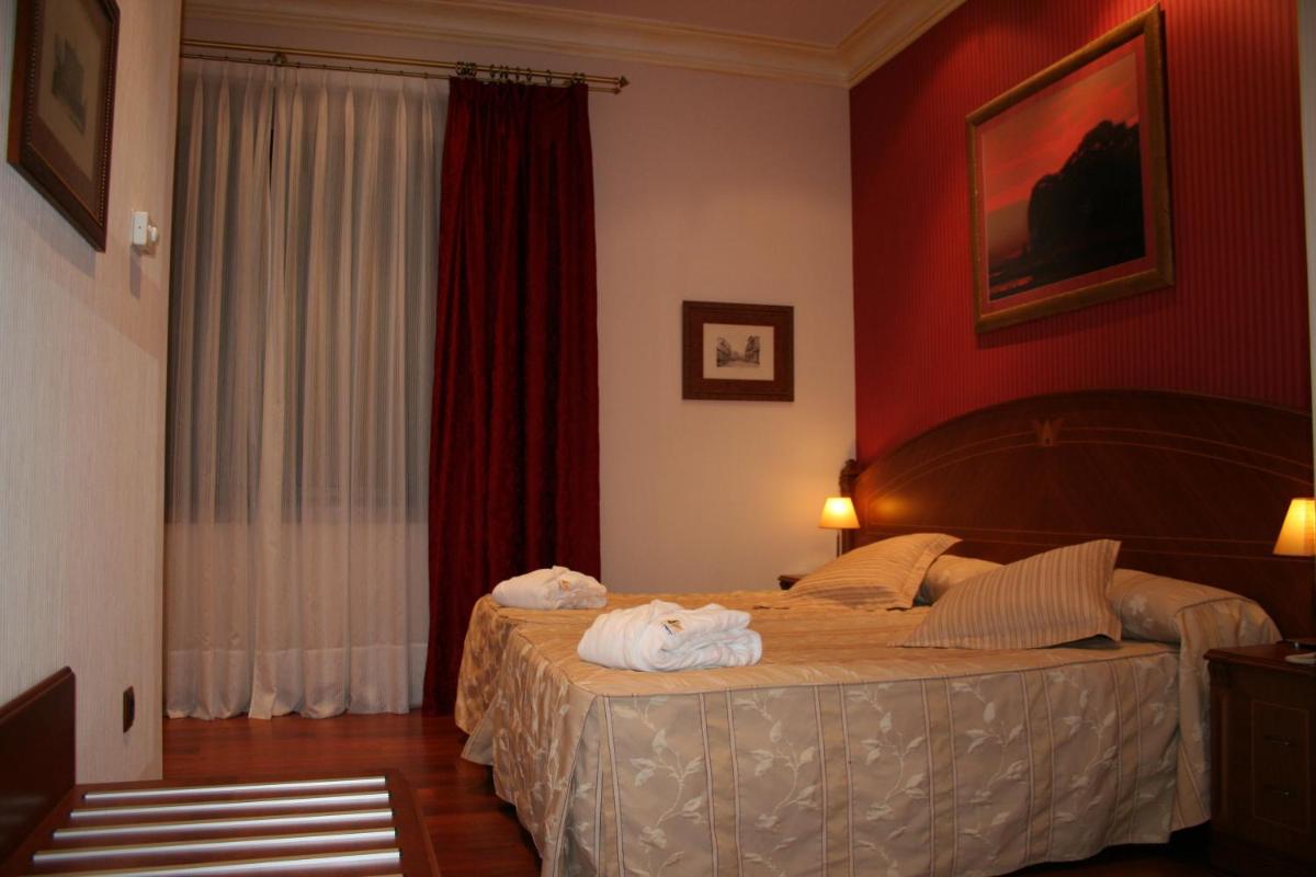 Cama o camas de una habitación en Hotel Palacio de la Magdalena