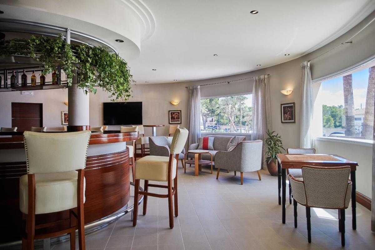 Una televisión o centro de entretenimiento en Boutiquehotel El Coto