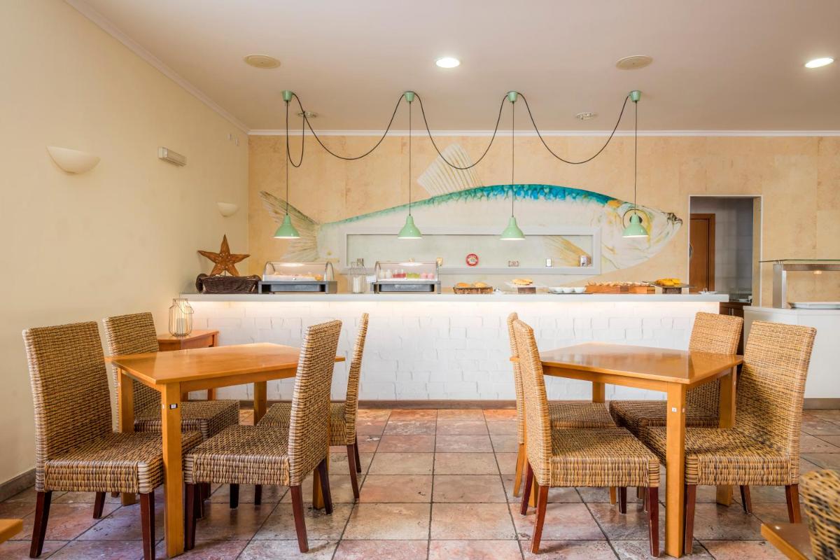 Uma área de estar em Clube Porto Mos - Sunplace Hotels & Beach Resort