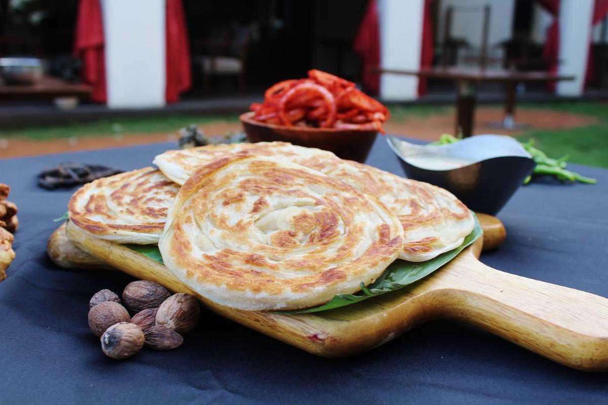two chapati pies on a table with nuts at Hyatt Hyderabad Gachibowli in Hyderabad