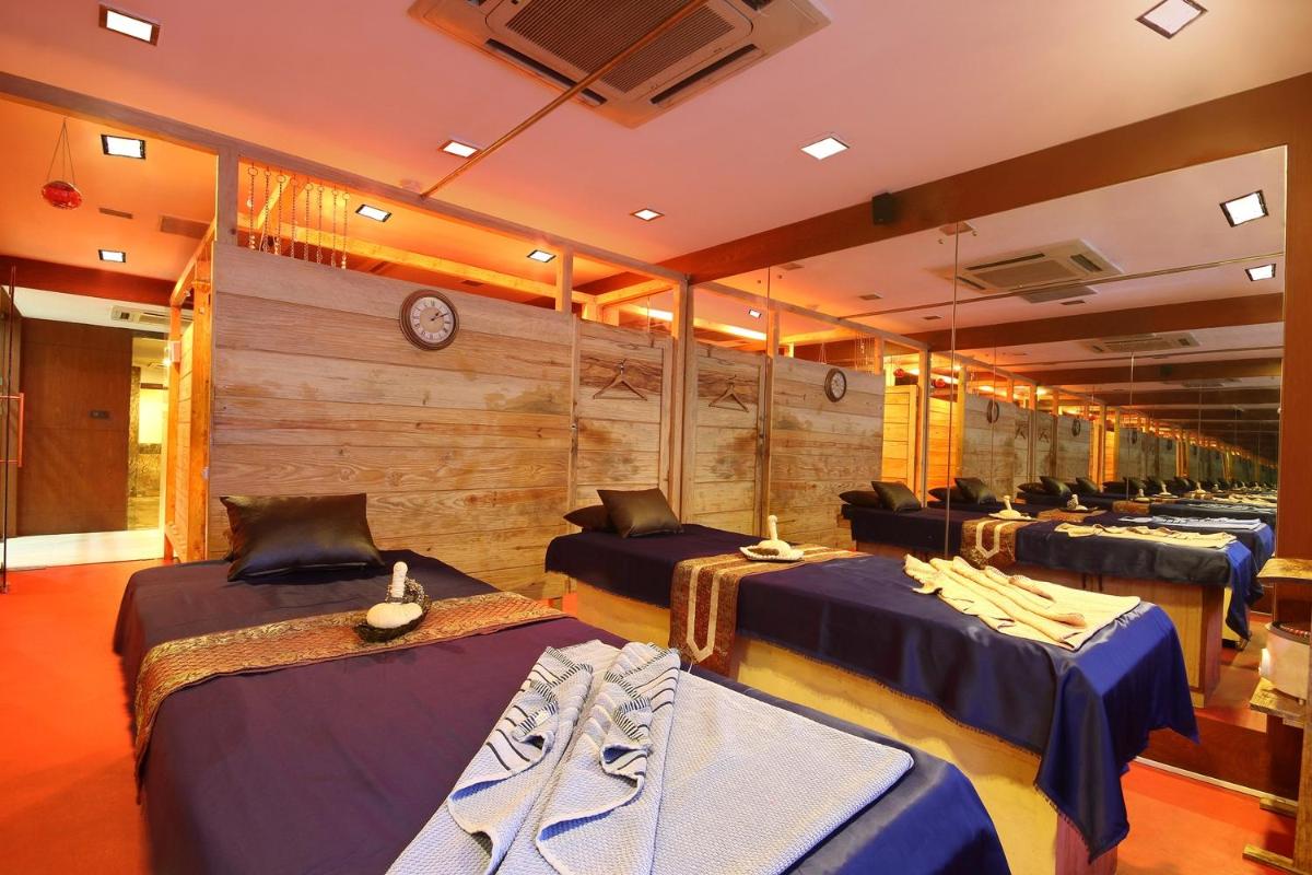 a room with a bunch of beds in it at Fortune Select JP Cosmos, Bengaluru - Member ITC Hotels' Group in Bengaluru