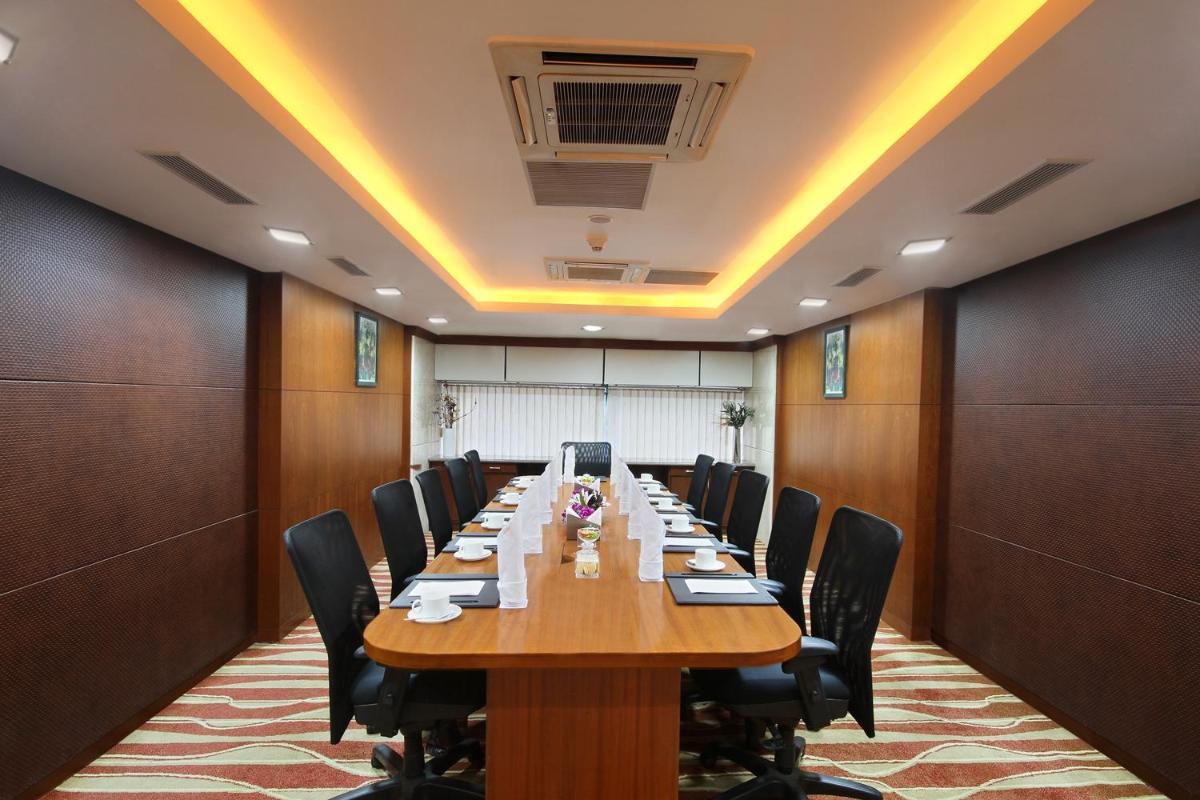 a large conference room with a long table and chairs at Fortune Select JP Cosmos, Bengaluru - Member ITC Hotels' Group in Bengaluru