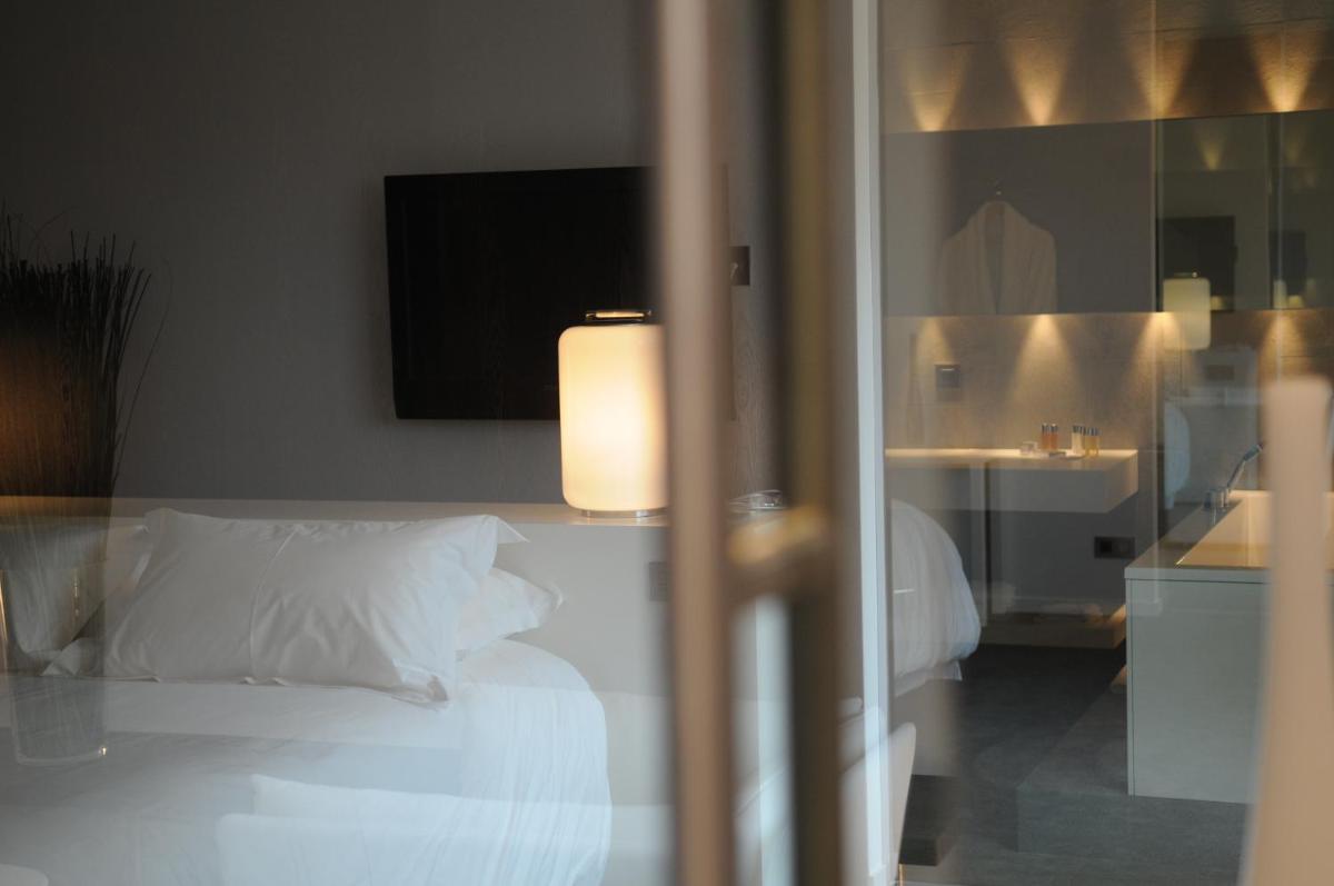 Un ou plusieurs lits dans un hébergement de l'établissement Bdesign & Spa