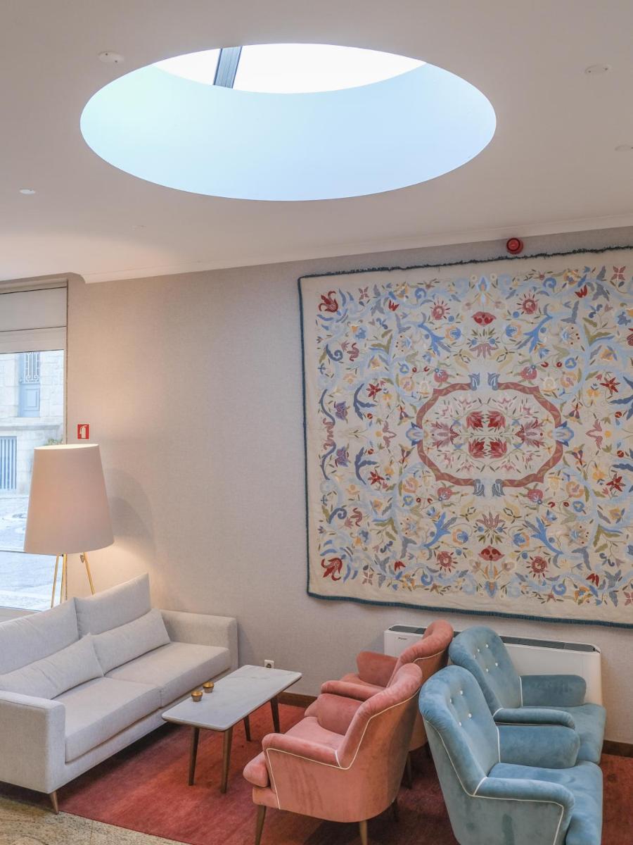 Uma área de estar em Hotel Vouga