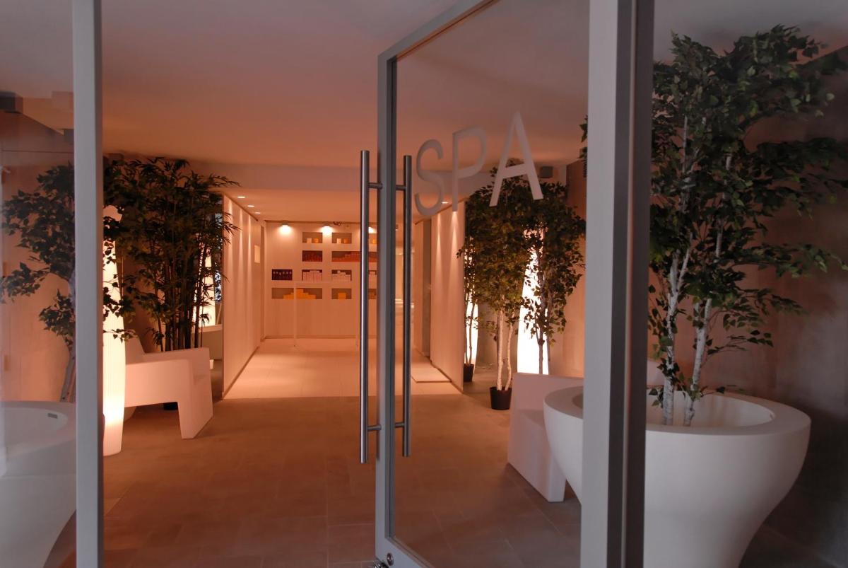 Un ou plusieurs lits dans un hébergement de l'établissement Bdesign & Spa