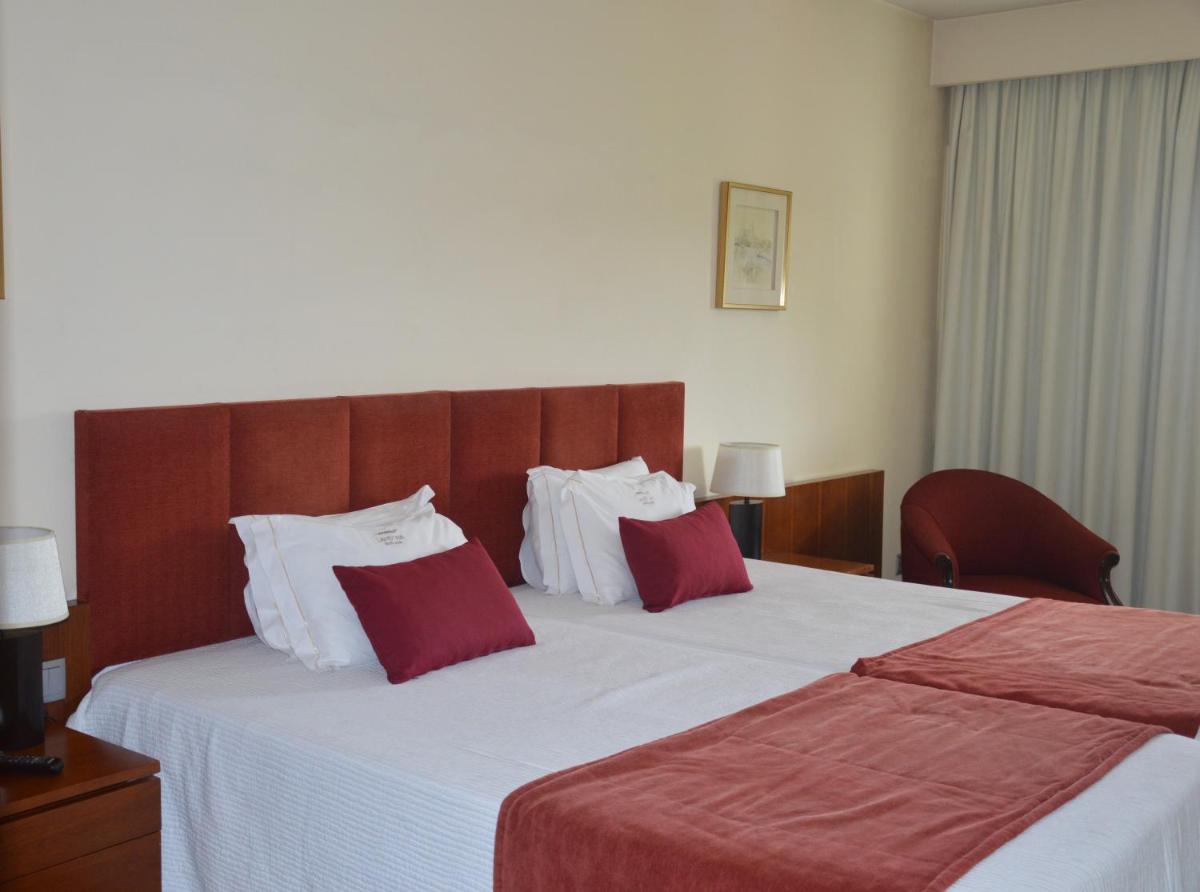 Uma cama ou camas num quarto em Santana Hotel & SPA