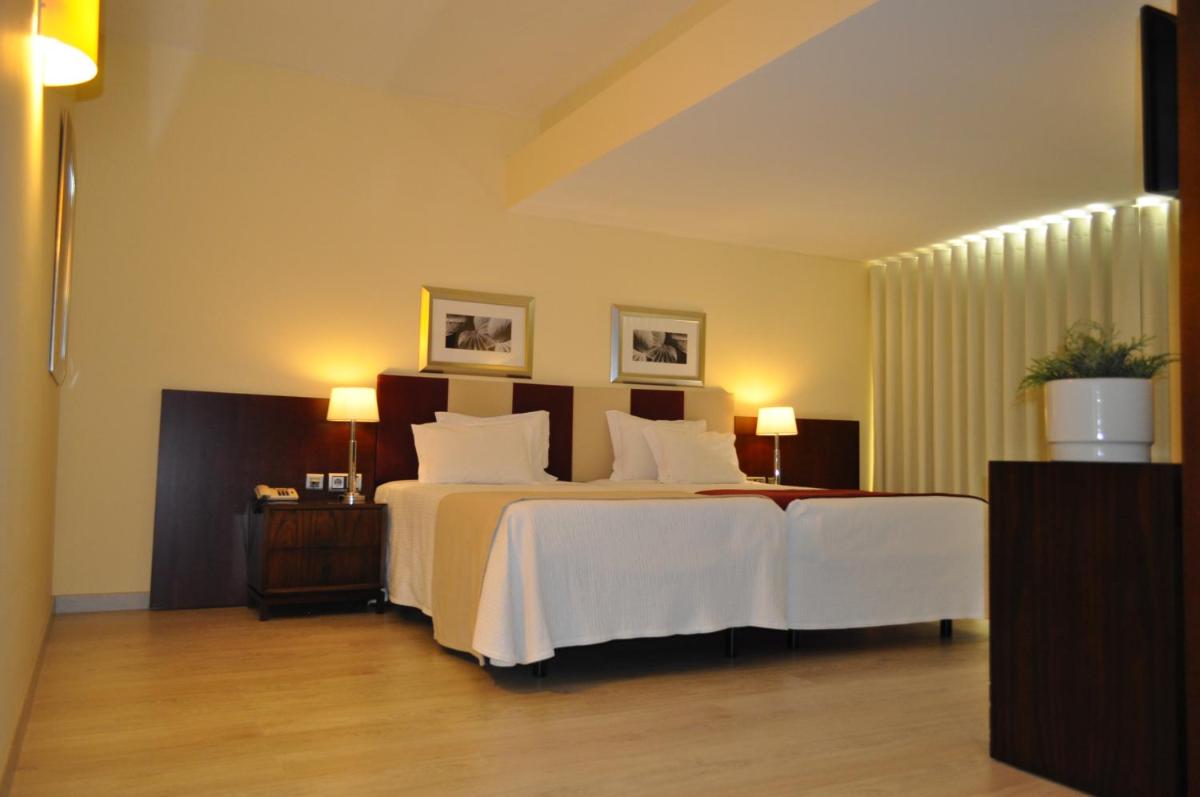 Uma cama ou camas num quarto em Santana Hotel & SPA