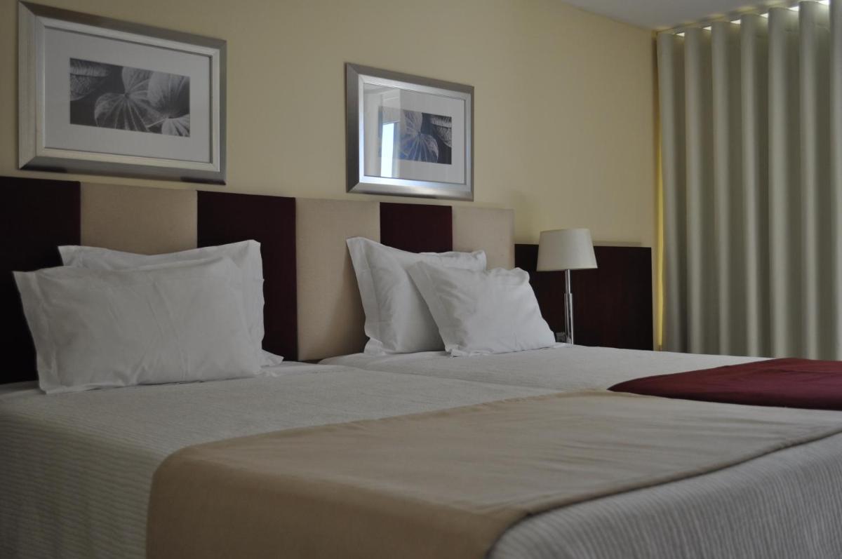 Uma cama ou camas num quarto em Santana Hotel & SPA