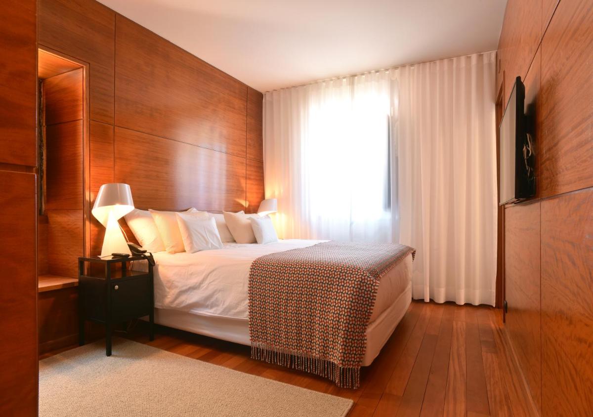 Uma cama ou camas num quarto em Casas Da Lapa, Nature & Spa Hotel