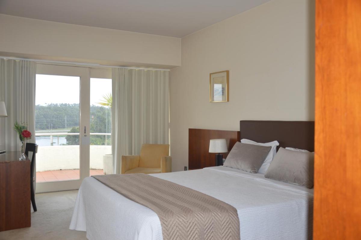 Uma cama ou camas num quarto em Santana Hotel & SPA