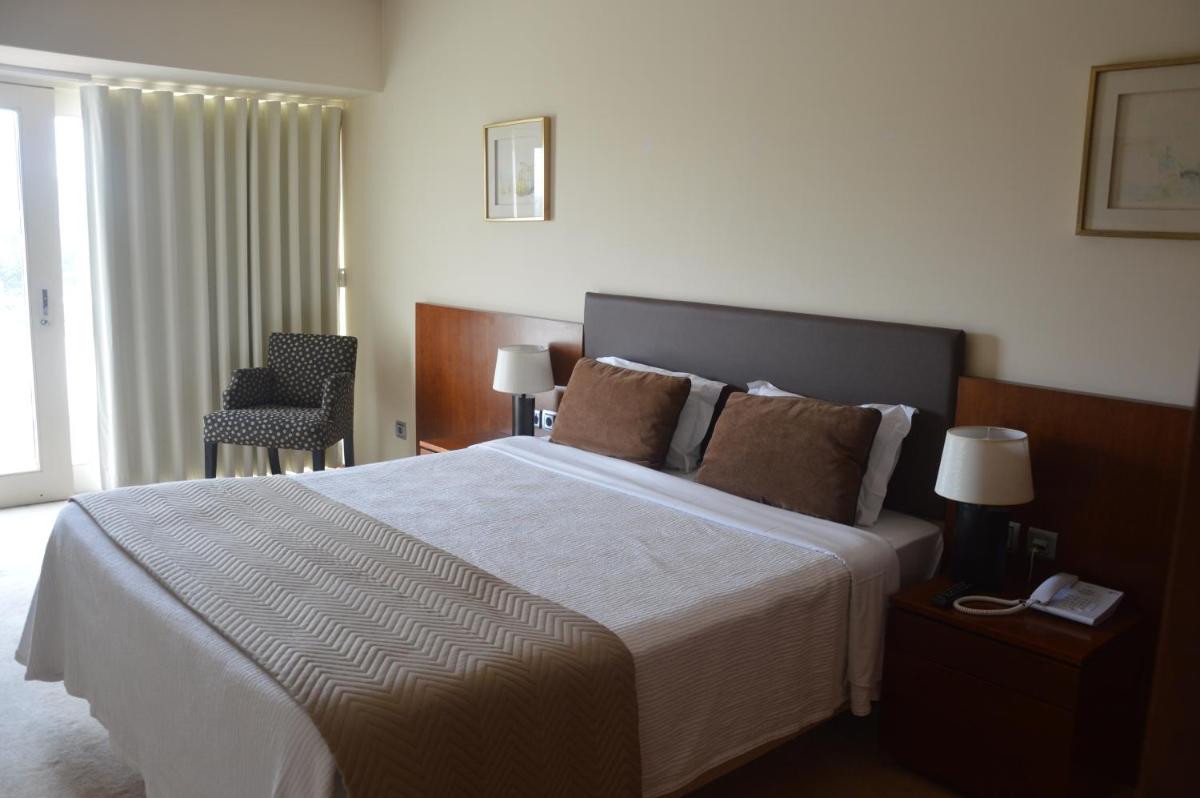 Uma cama ou camas num quarto em Santana Hotel & SPA