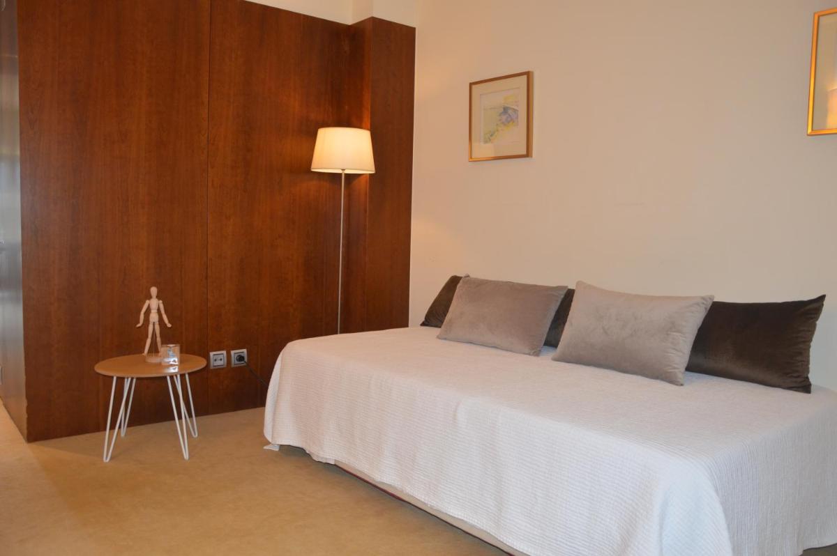 Uma cama ou camas num quarto em Santana Hotel & SPA