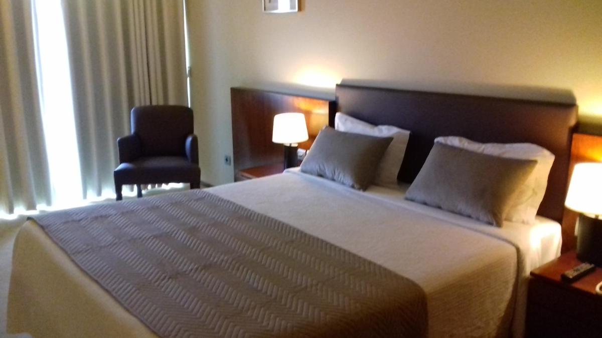 Uma cama ou camas num quarto em Santana Hotel & SPA