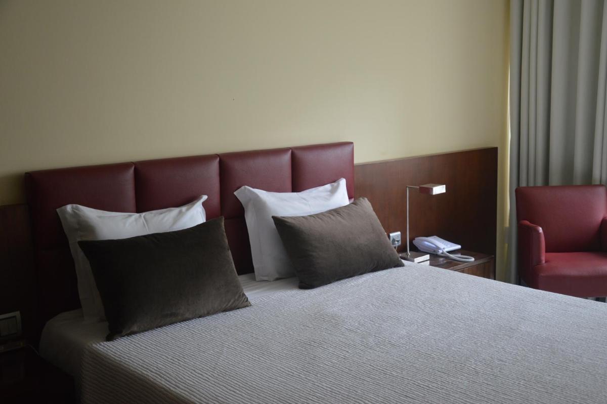 Uma cama ou camas num quarto em Santana Hotel & SPA