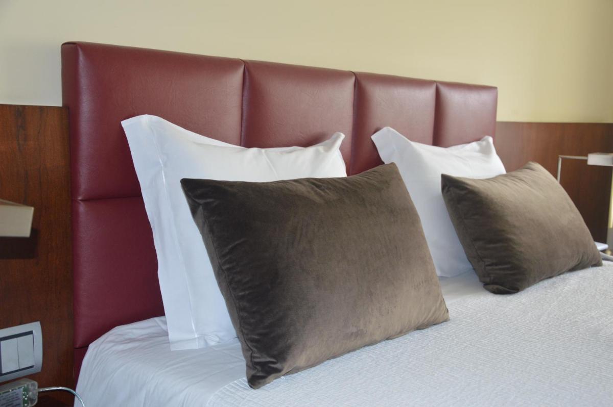 Uma cama ou camas num quarto em Santana Hotel & SPA
