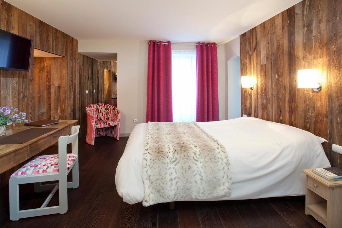 Un ou plusieurs lits dans un hébergement de l'établissement Hotel le Chalet