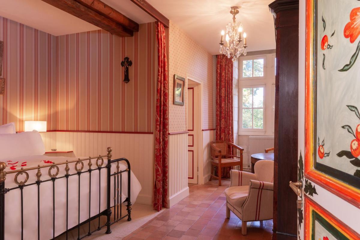Un ou plusieurs lits dans un hébergement de l'établissement Le Domaine de Mestré, The Originals Relais