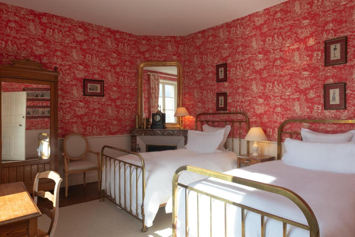 Un ou plusieurs lits dans un hébergement de l'établissement Le Domaine de Mestré, The Originals Relais