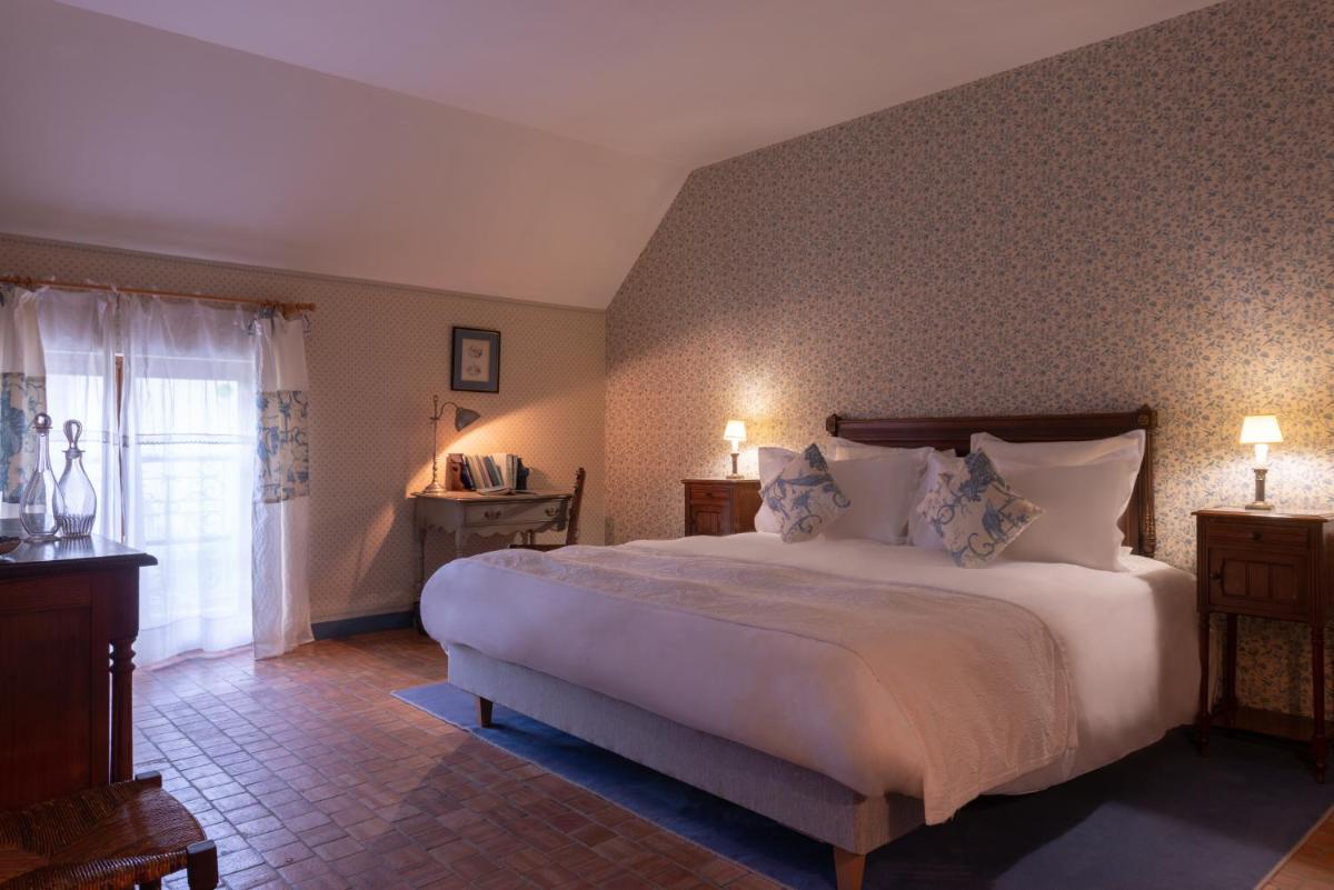 Un ou plusieurs lits dans un hébergement de l'établissement Le Domaine de Mestré, The Originals Relais