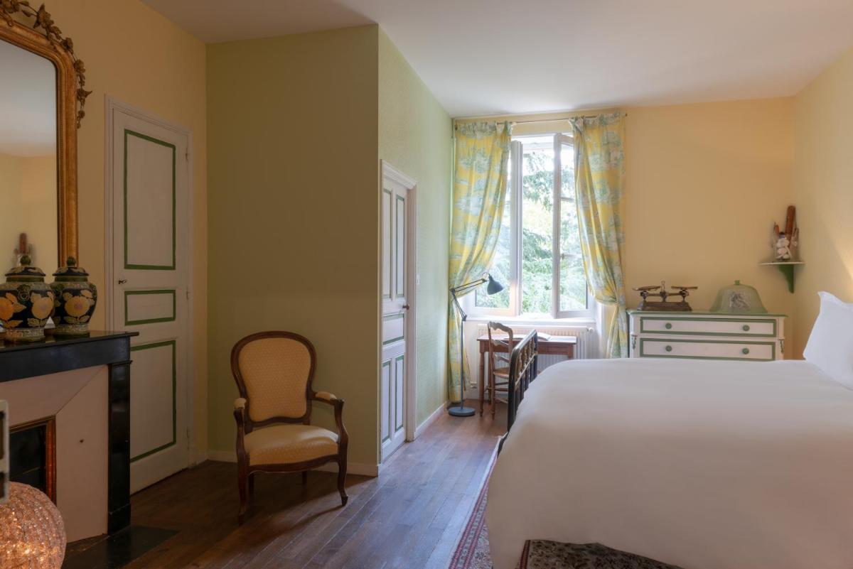 Un ou plusieurs lits dans un hébergement de l'établissement Le Domaine de Mestré, The Originals Relais