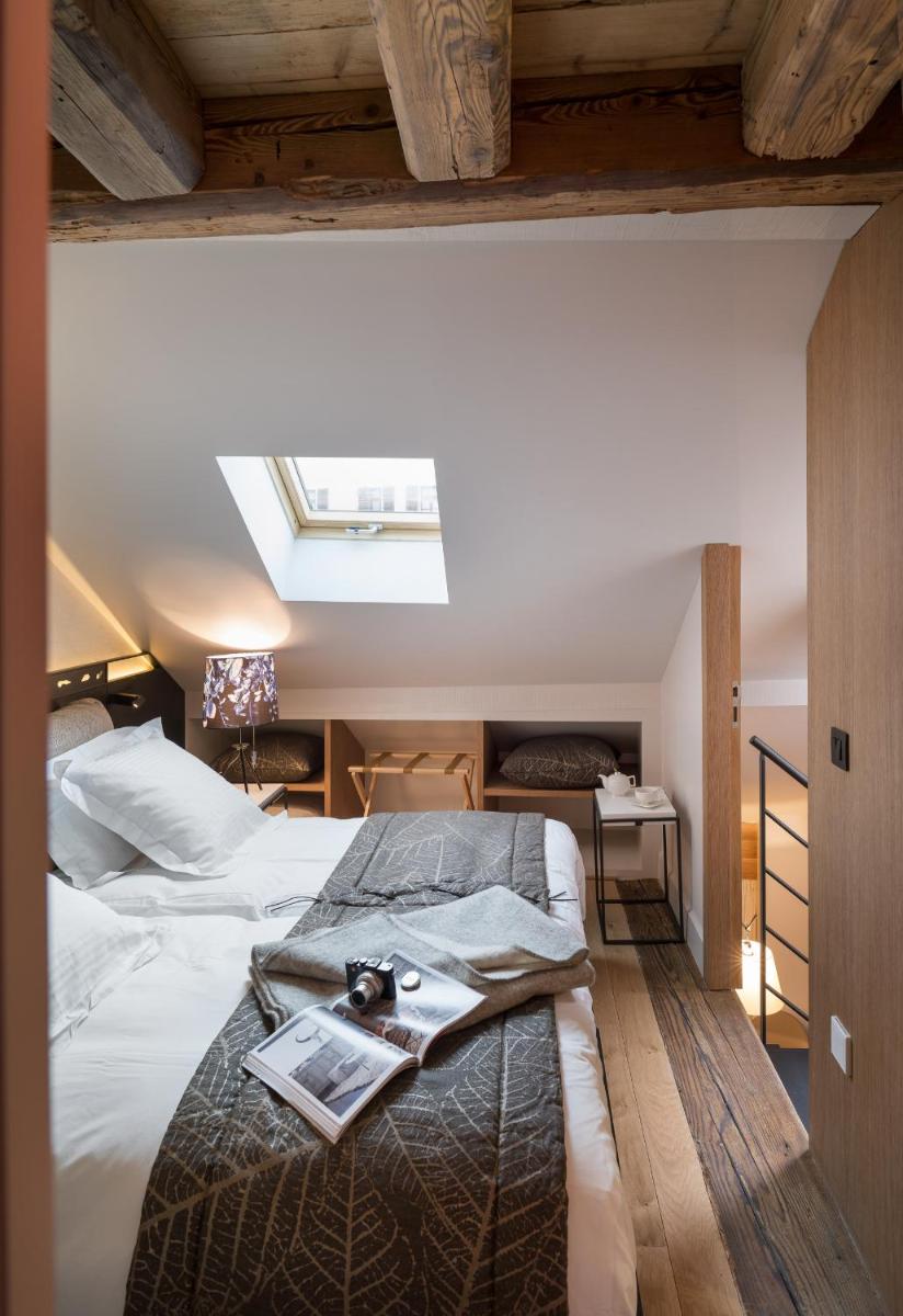 Un ou plusieurs lits dans un hébergement de l'établissement Les Loges Annecy Vieille Ville