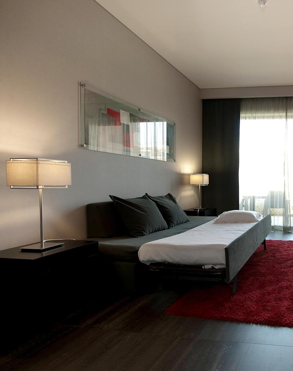 Uma cama ou camas num quarto em Vila Gale Lagos
