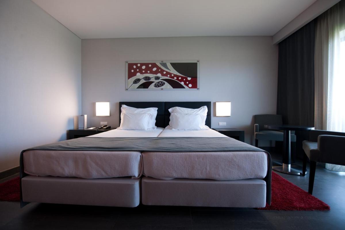Uma cama ou camas num quarto em Vila Gale Lagos