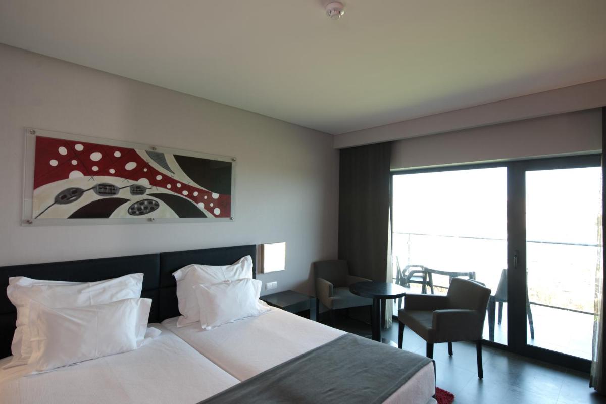 Uma cama ou camas num quarto em Vila Gale Lagos