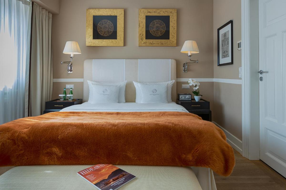 Ein Bett oder Betten in einem Zimmer der Unterkunft House of Hütter- Heidelberg Suites Boutique