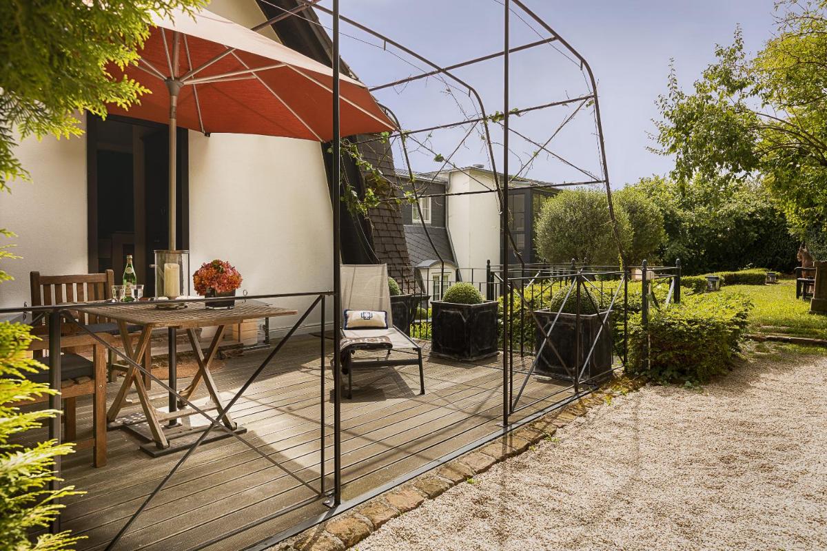 Ein Garten an der Unterkunft House of Hütter- Heidelberg Suites Boutique