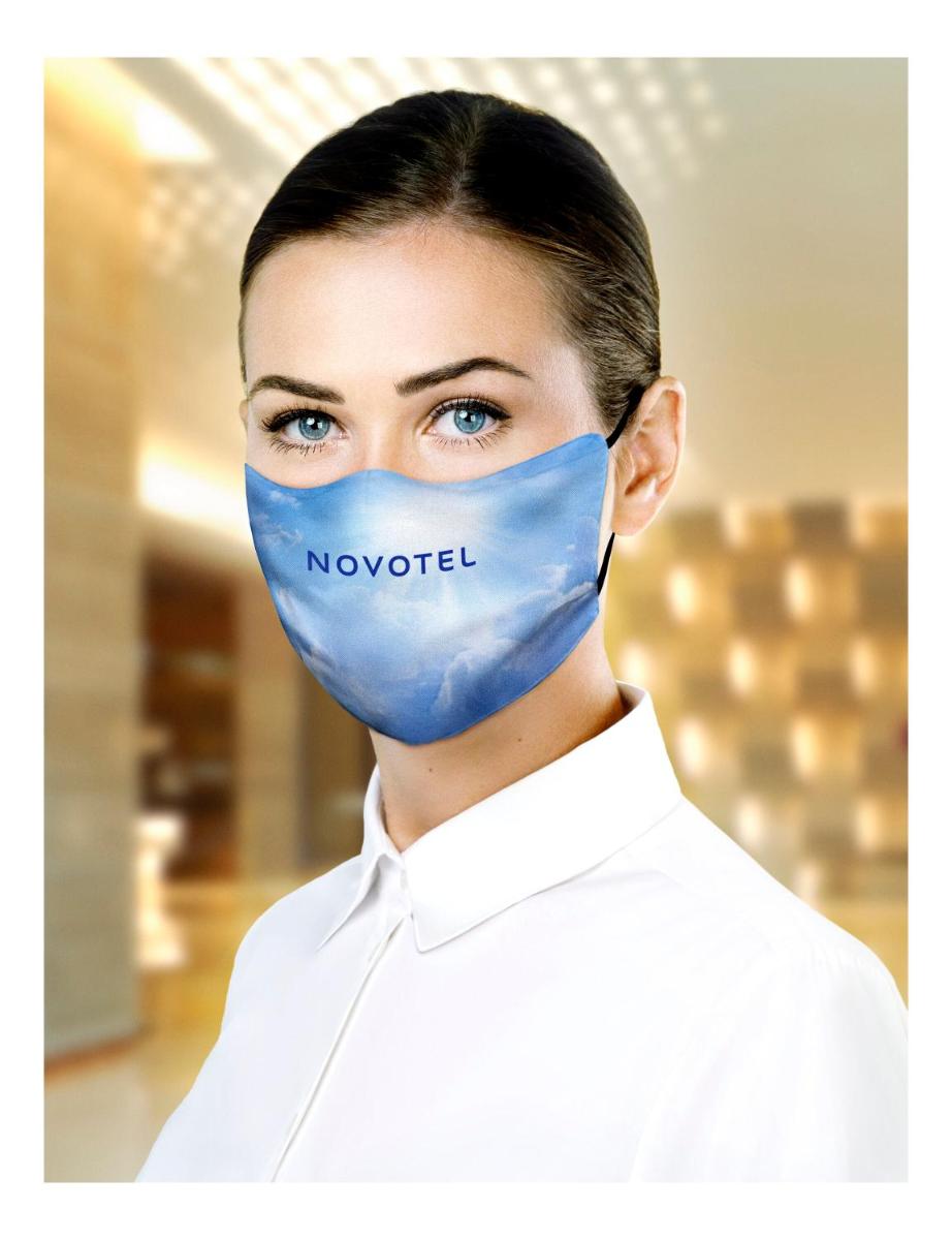 a woman wearing a blue mask with the word november at Novotel Kochi Infopark in Cochin