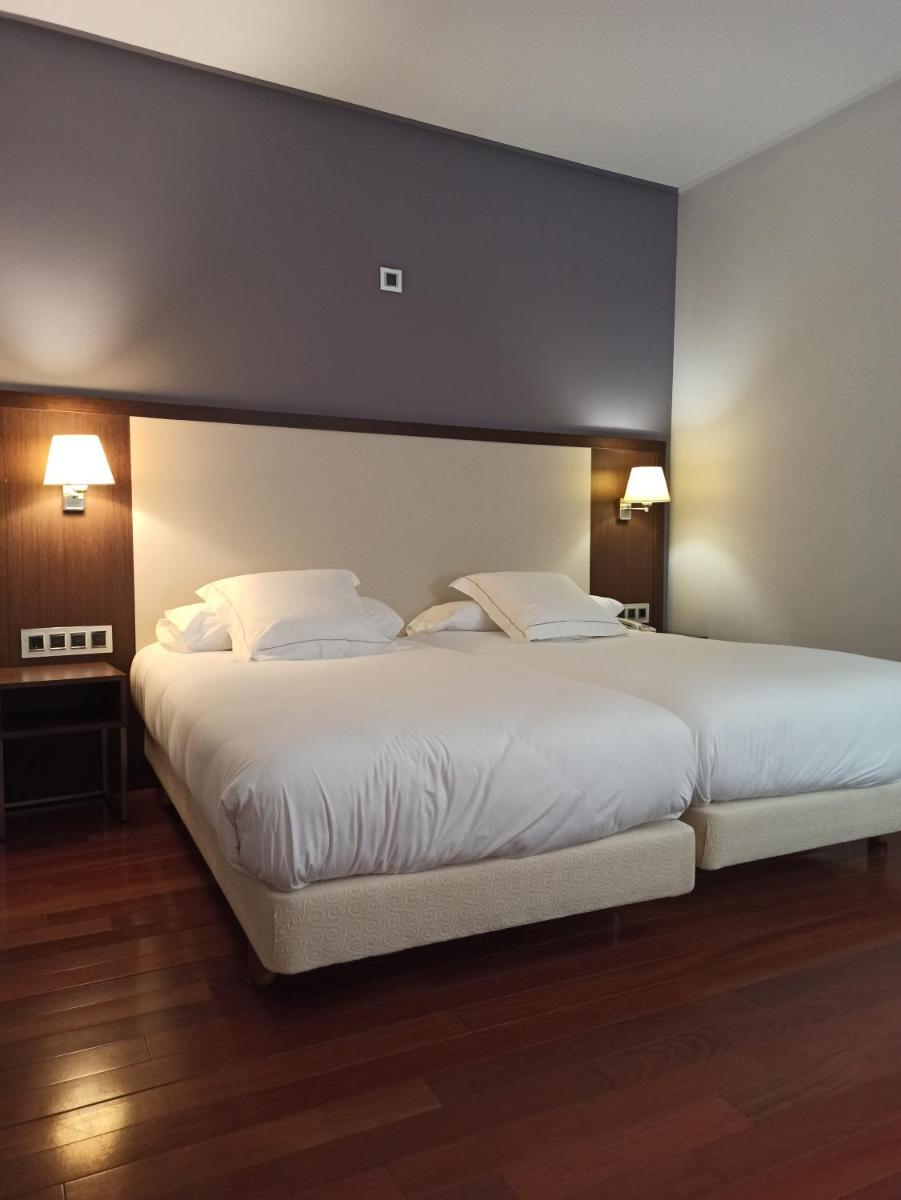 Cama o camas de una habitación en ARVA Spa París
