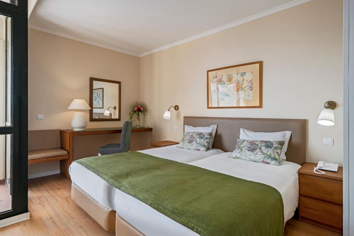 Uma cama ou camas num quarto em Dorisol Mimosa Studio Hotel
