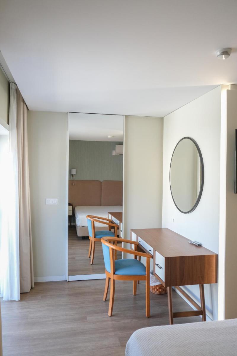 Uma área de estar em Hotel Vouga