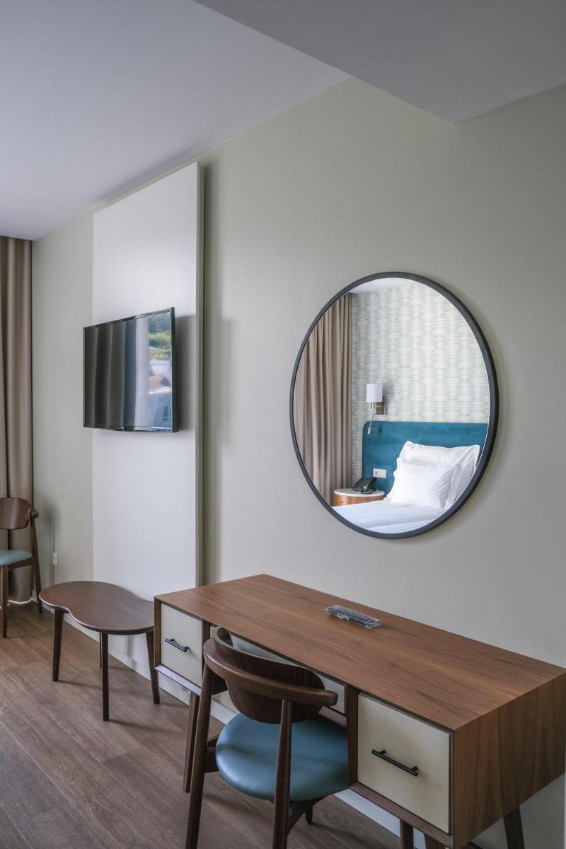 Uma televisão e/ou sistema de entretenimento em Hotel Vouga