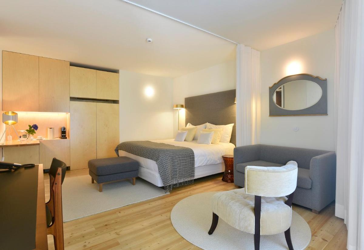 Uma cama ou camas num quarto em Casas Da Lapa, Nature & Spa Hotel